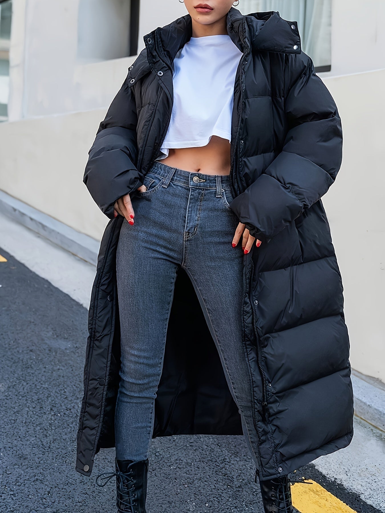 Women's Long Black Puffer Jacket with Hood and Full-Length Quilted Design